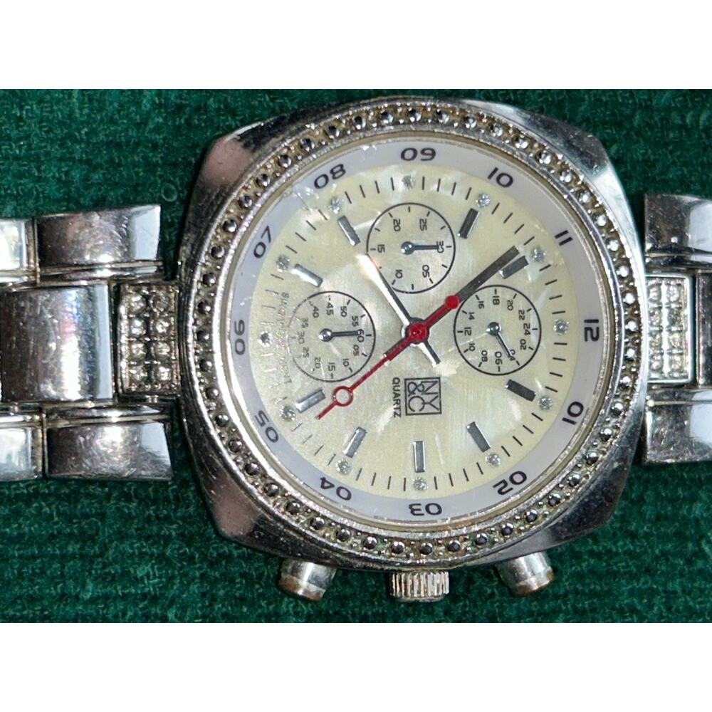 NY&Co Silver Tone Crystal Bezel Watch MOP Dial Red Second Hand Quartz